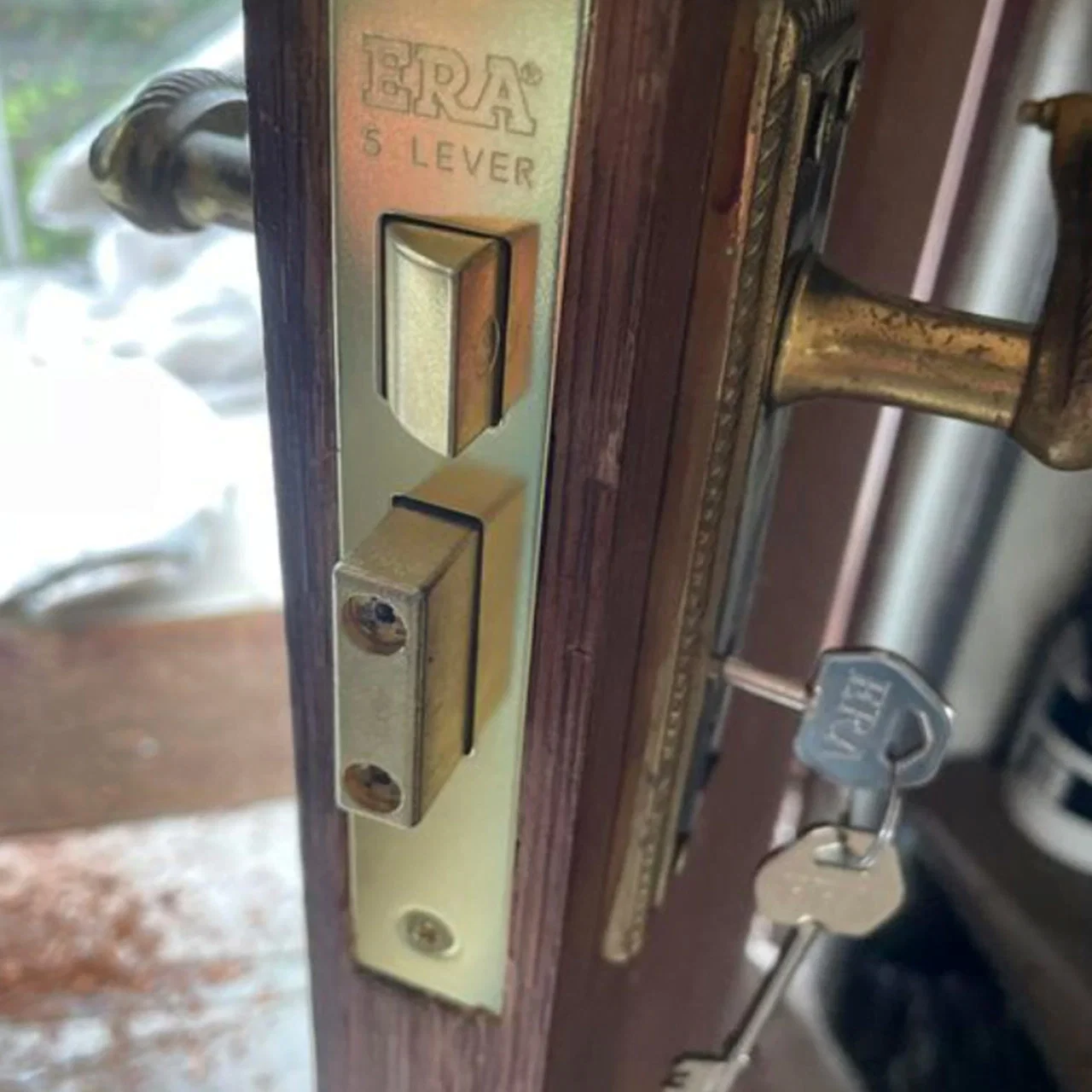 Residential locksmith fitting a new cylinder